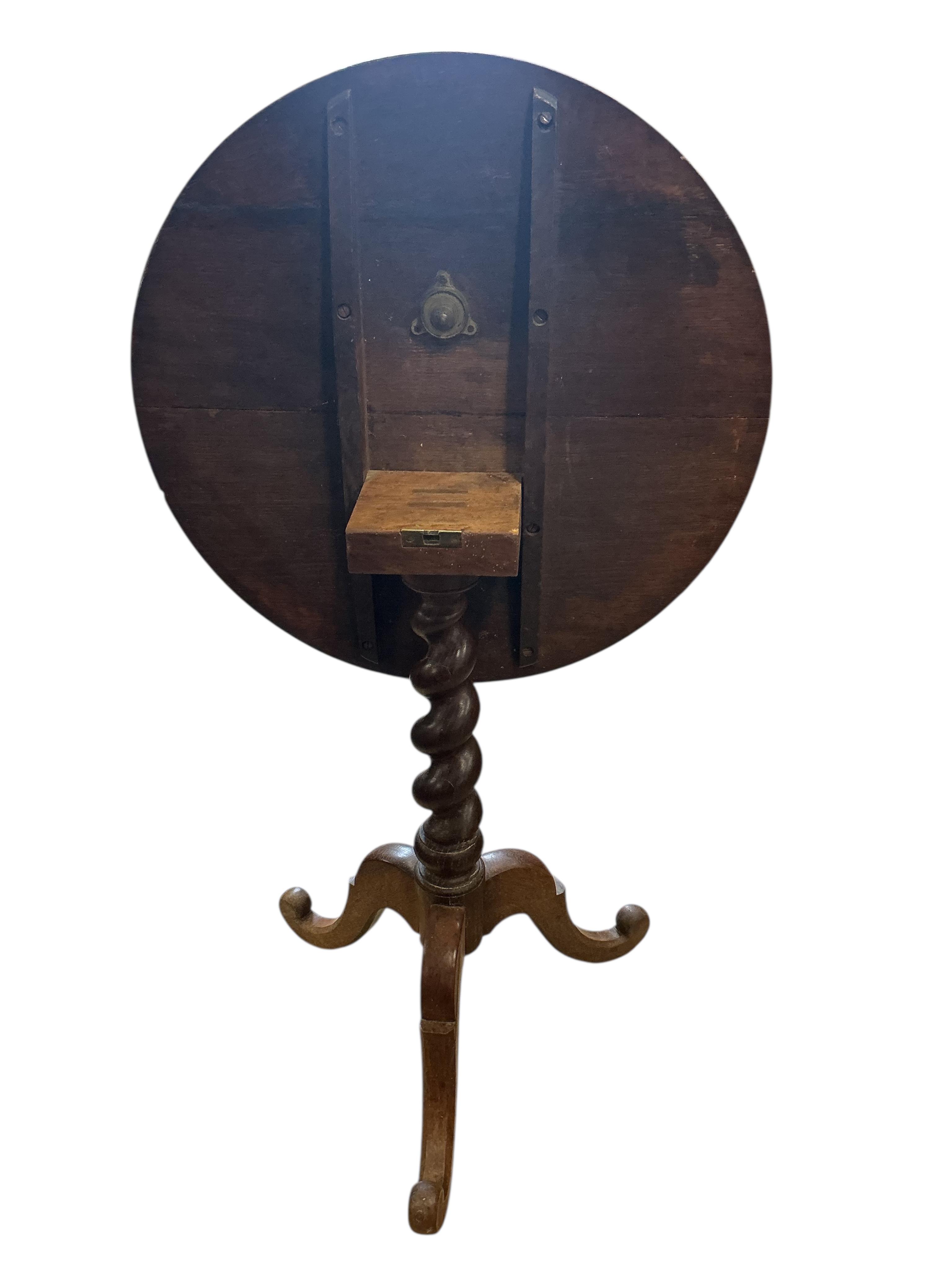 A 19th century circular oak tilt top tripod wine table, diameter 60cm, height 72cm